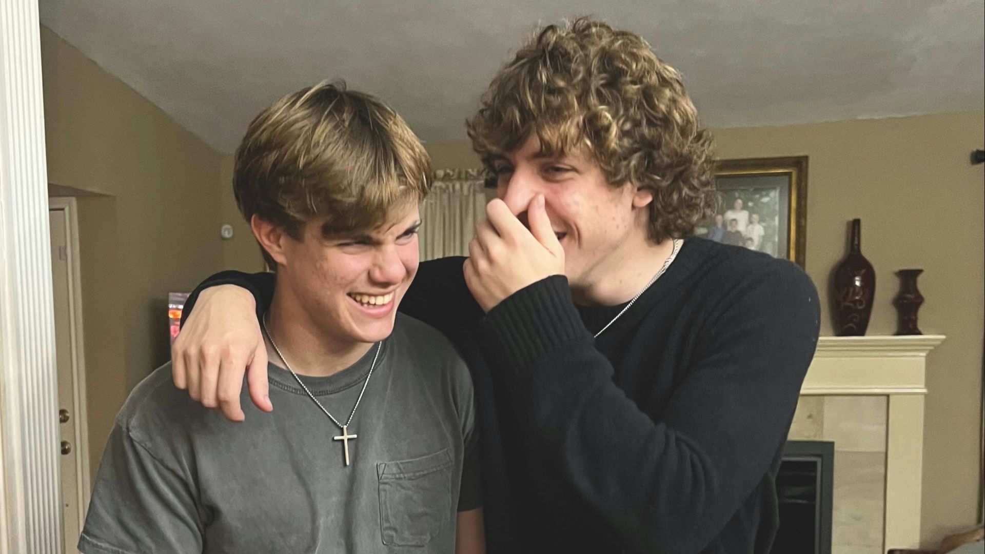 A couple of young men standing next to each other