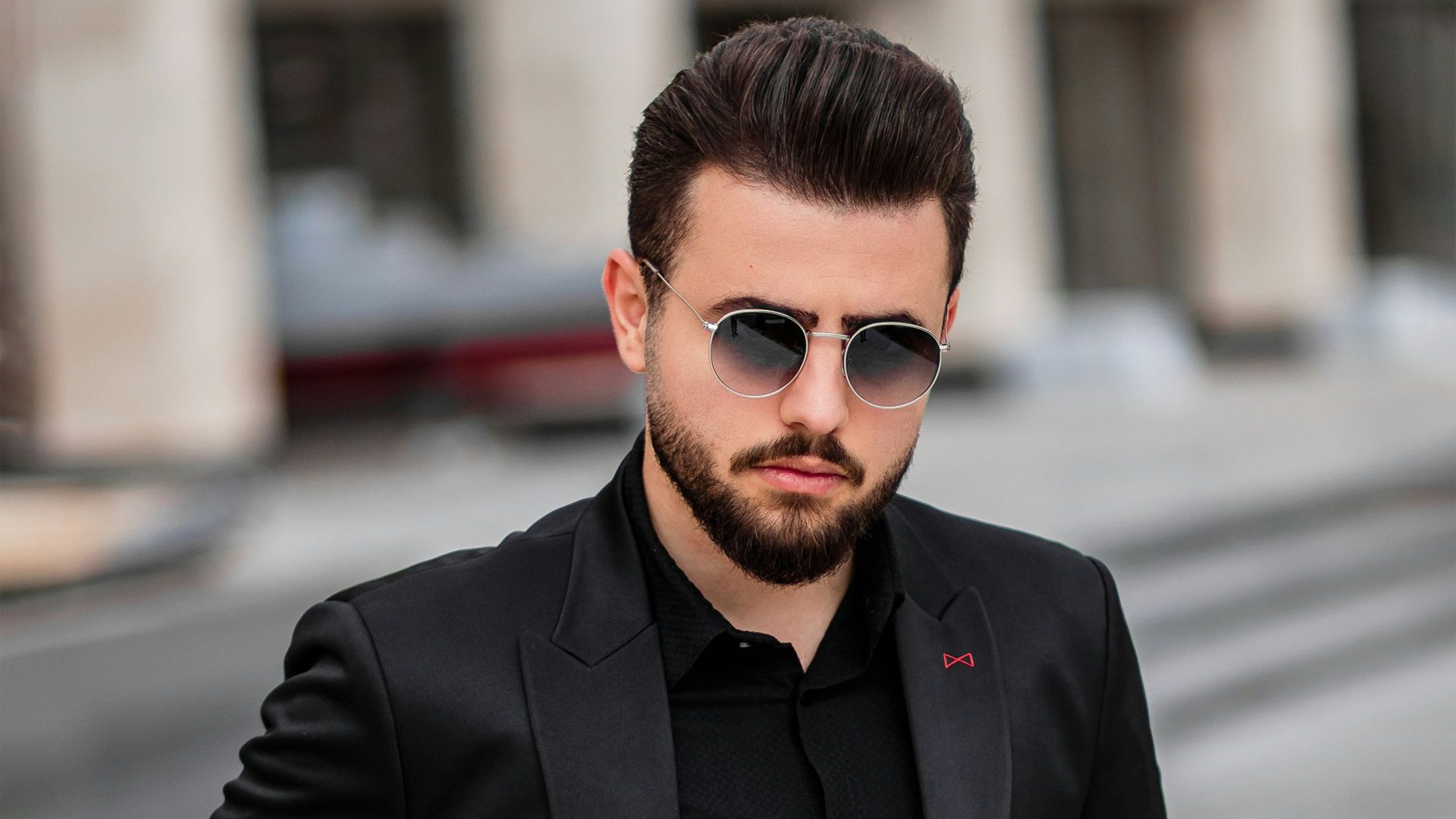 man in black suit jacket and black sunglasses