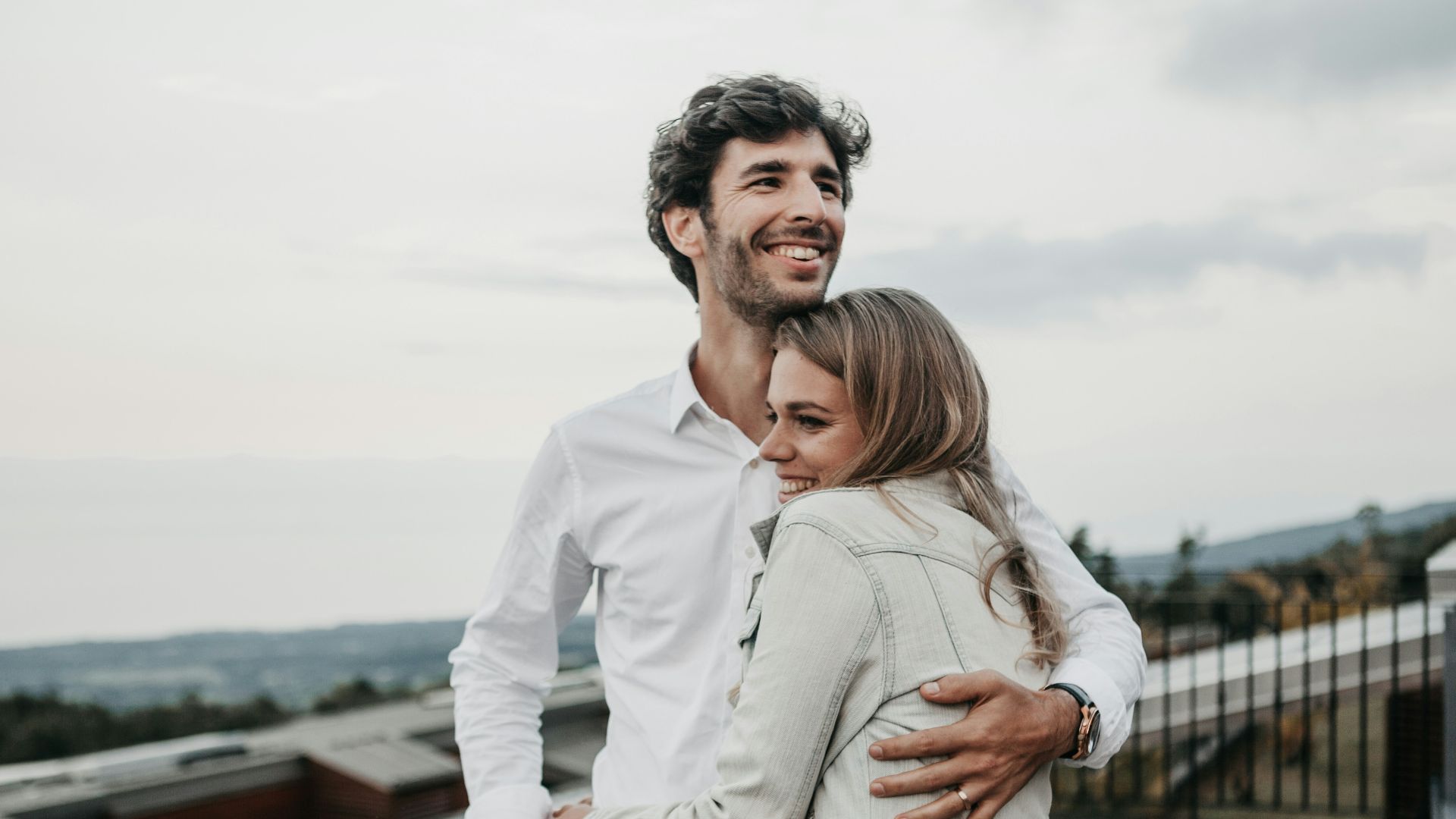 man and woman hugging each other