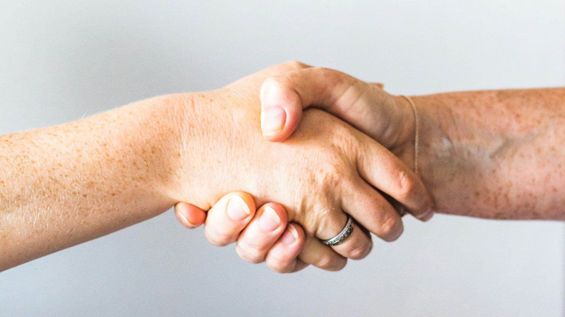 person holding hands of another person