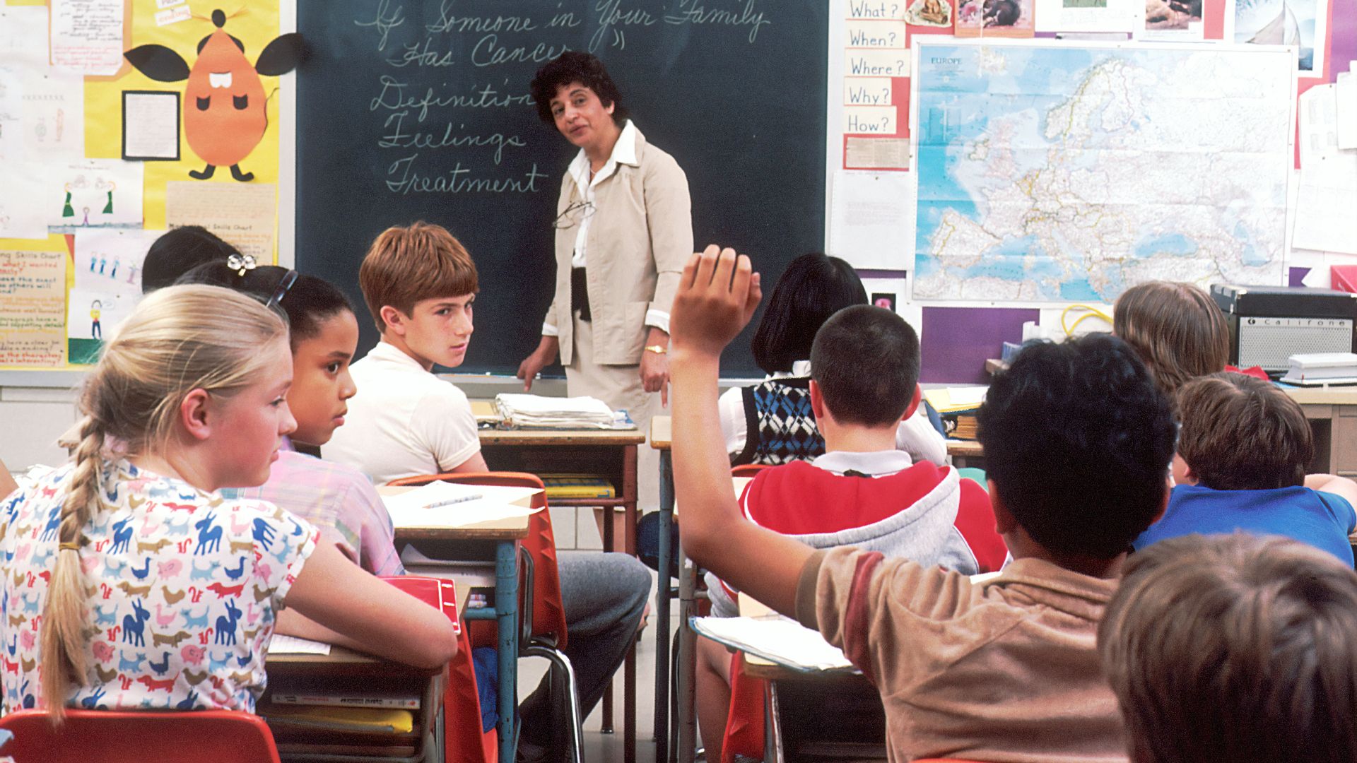 woman standing in front of children