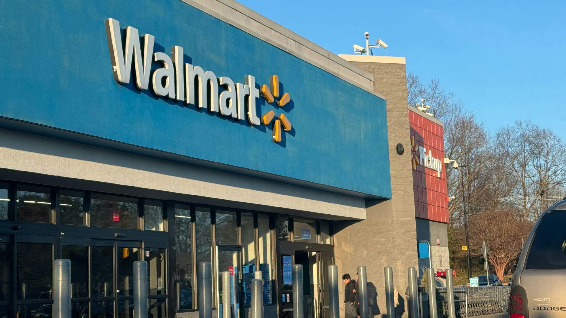 a walmart store with a car parked in front of it