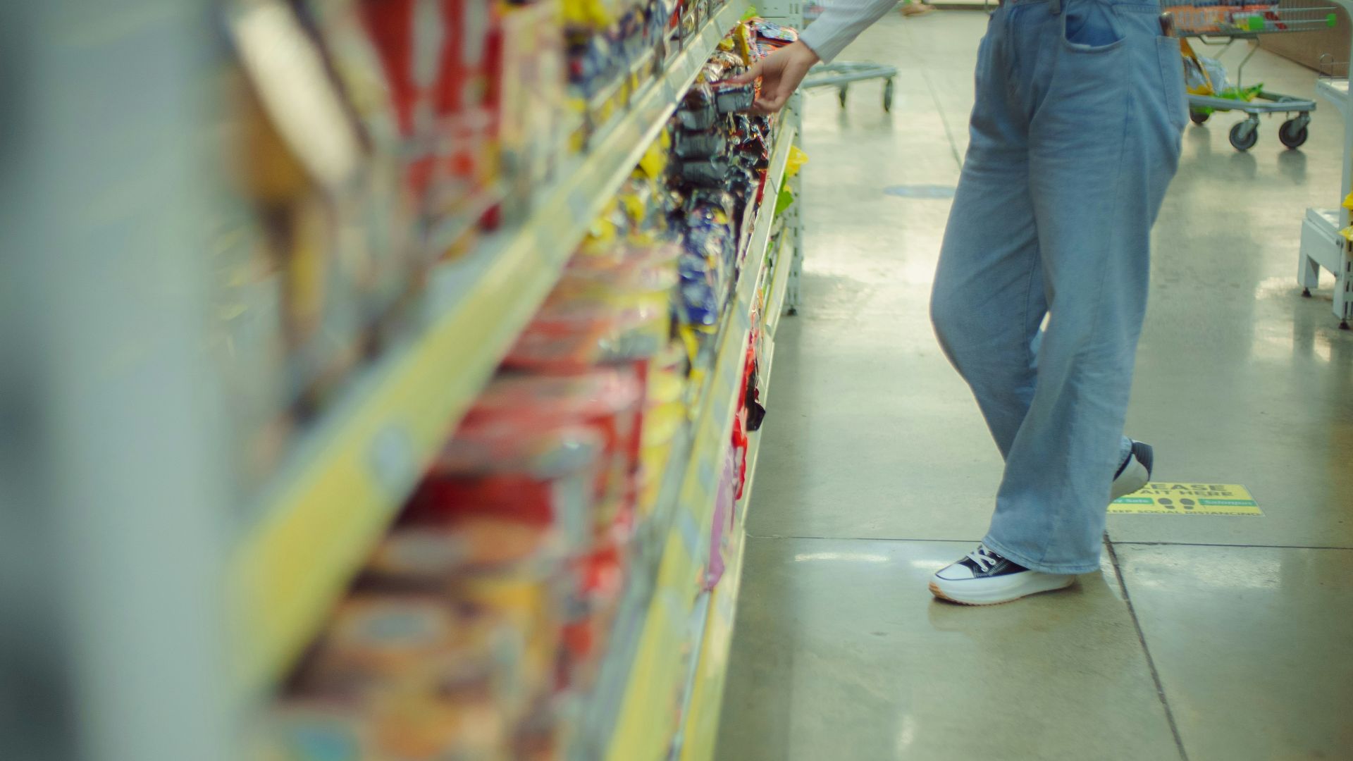 a man is shopping in a grocery store