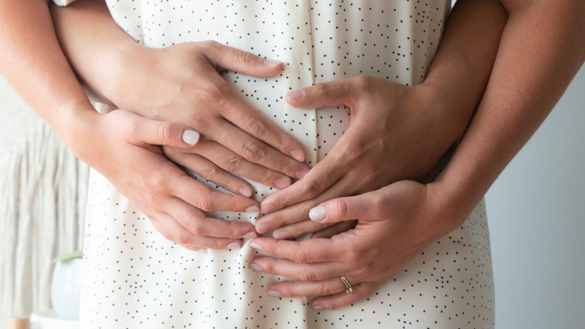 person touching person's belly