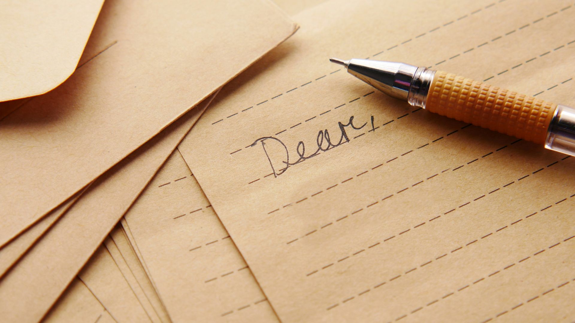 a pen sitting on top of a piece of paper