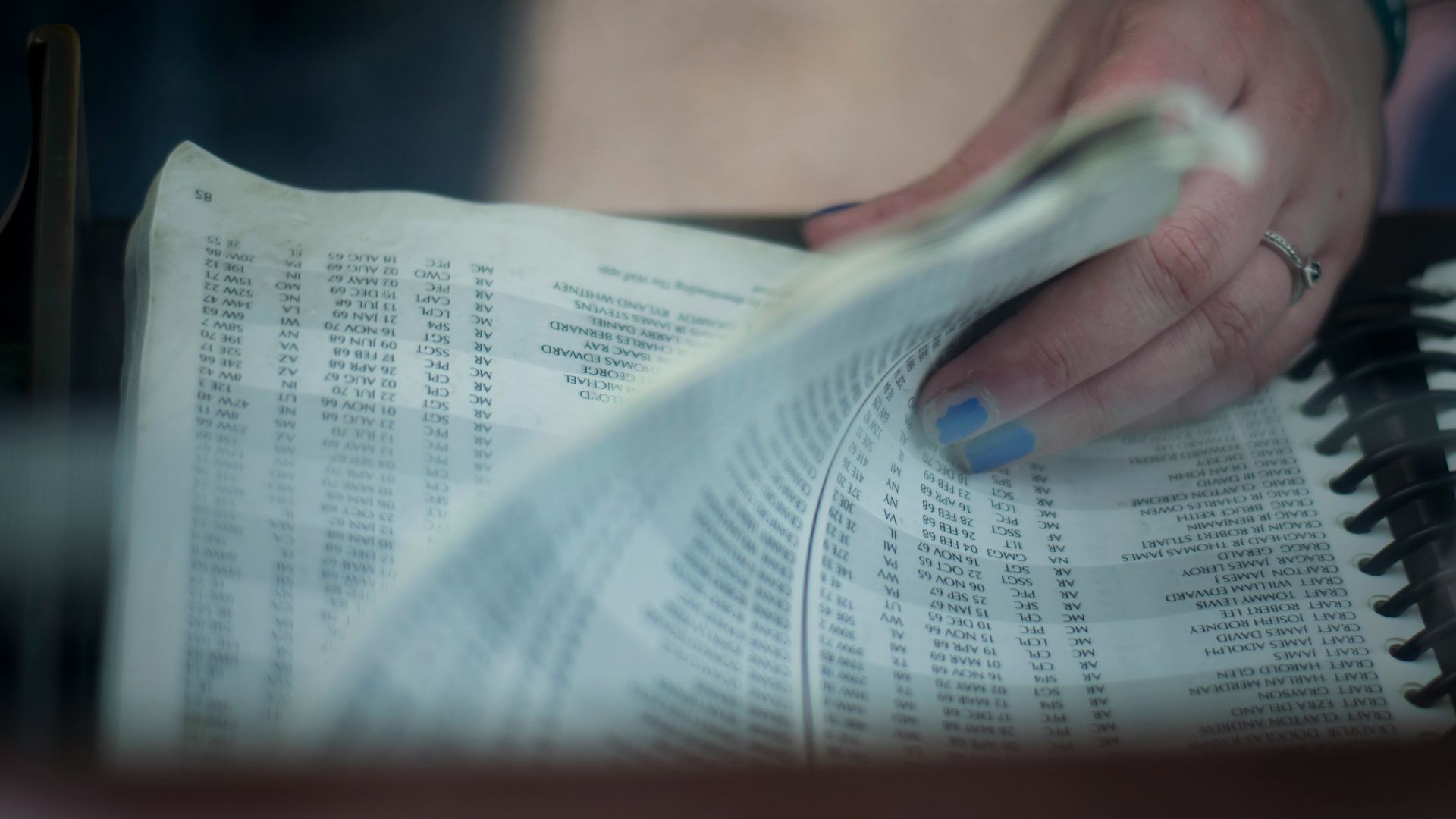 person's holding book