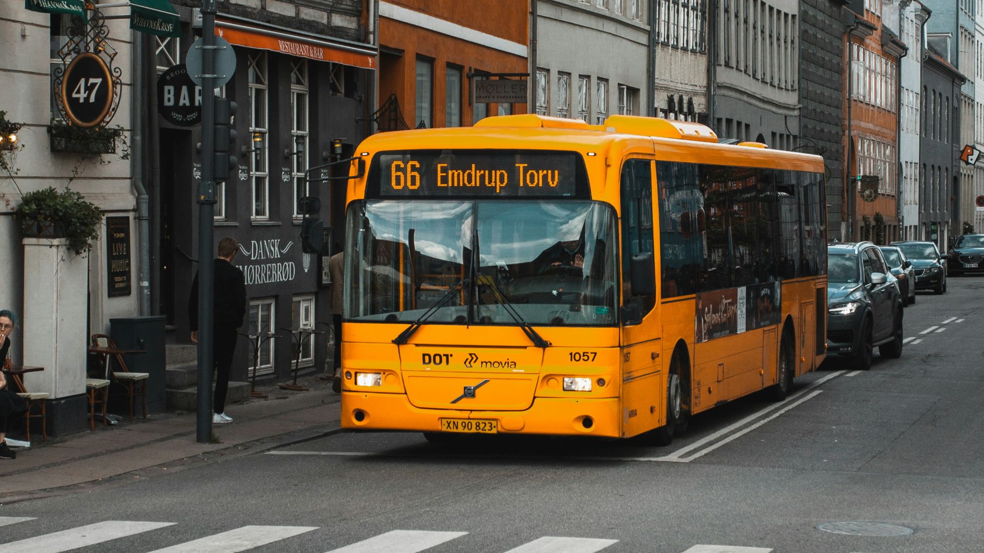 yellow and black bus on road at daytime