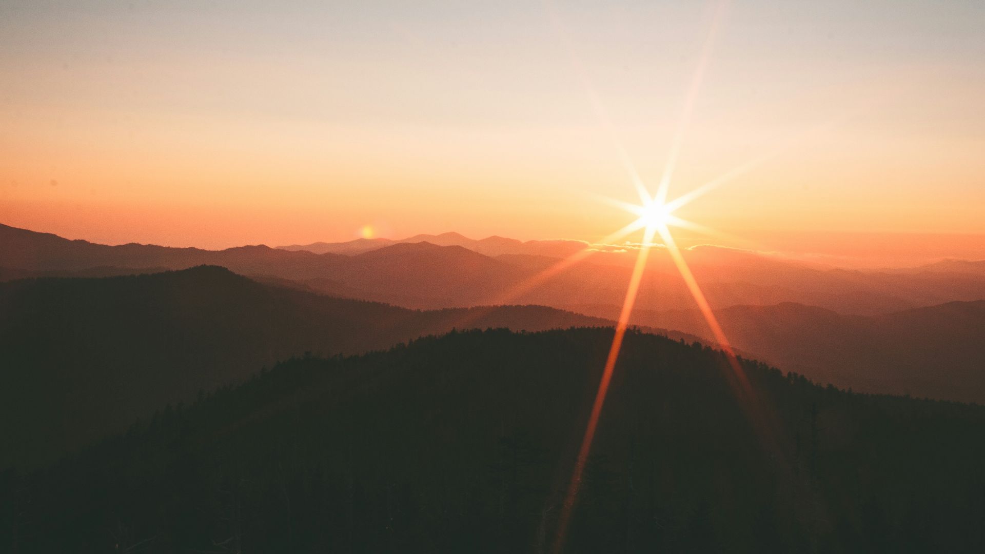 silhoutte of mountains during sunset