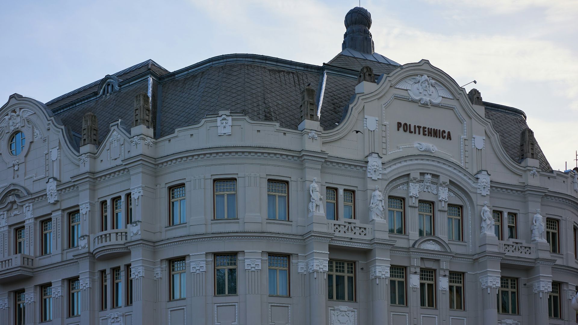 a large building with a clock on the top of it