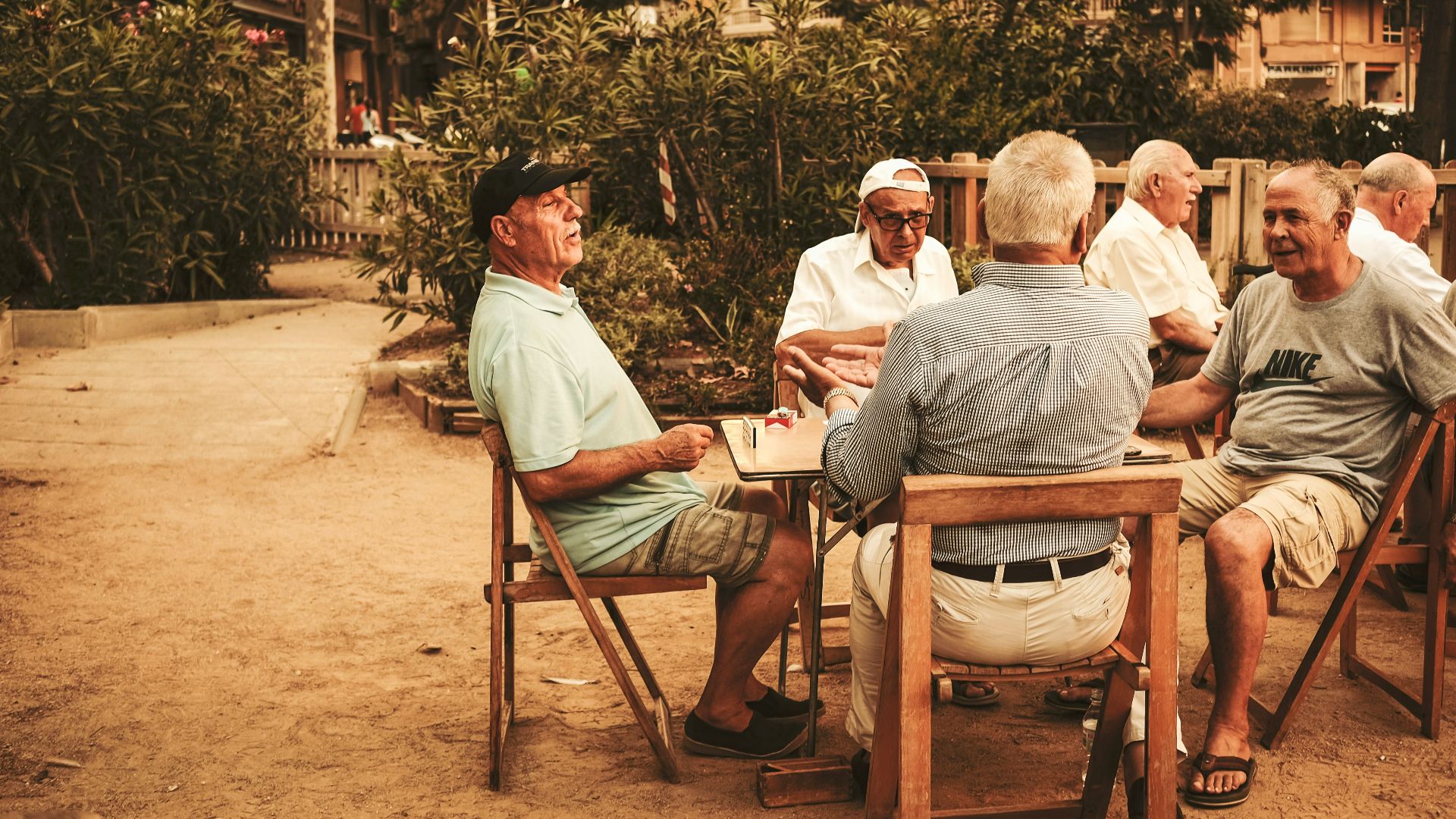 group of old men sitting near table