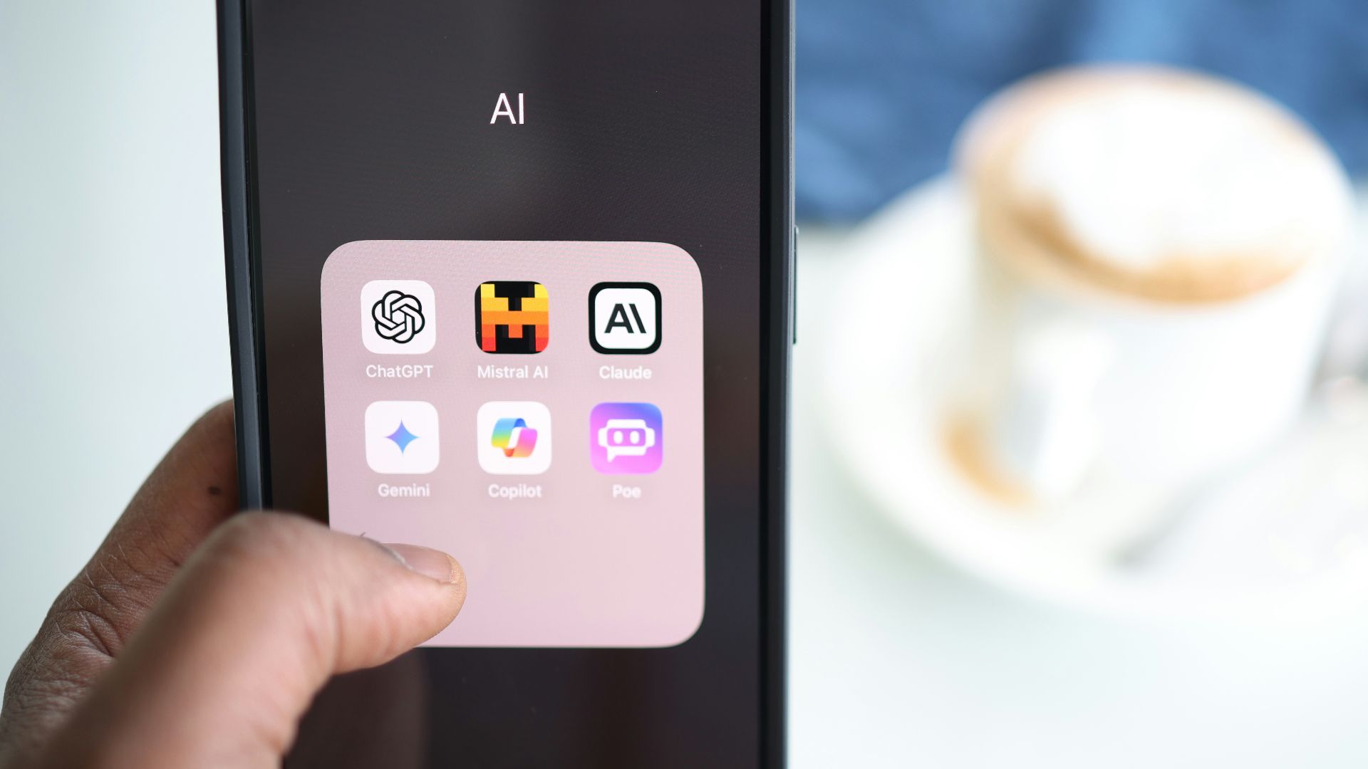 a person holding a cell phone in their hand