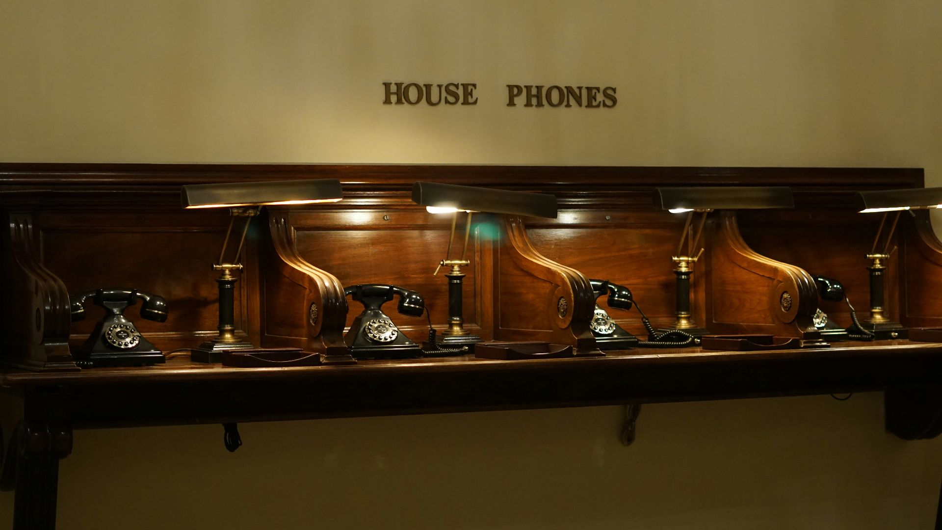 a wooden table with a few antique objects on it