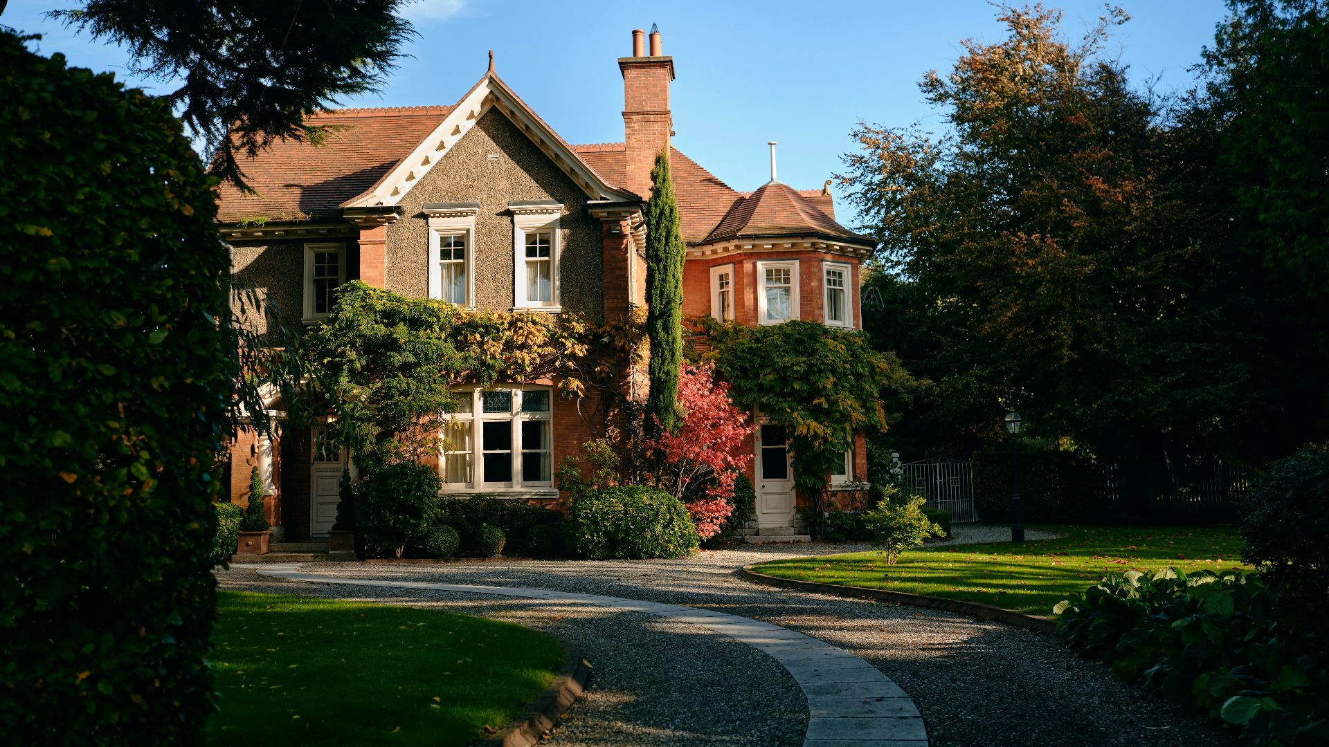a large house with a driveway leading to it