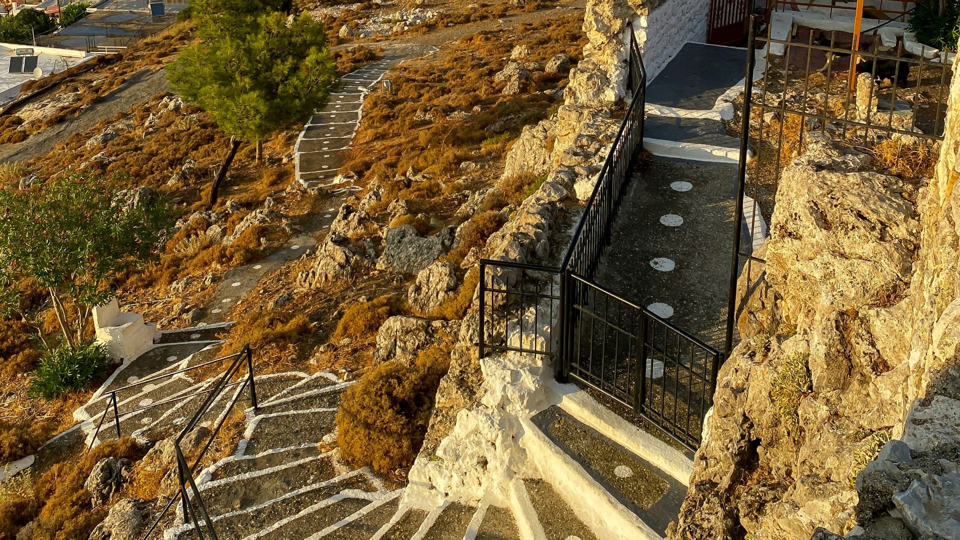 a view of a town from a cliff