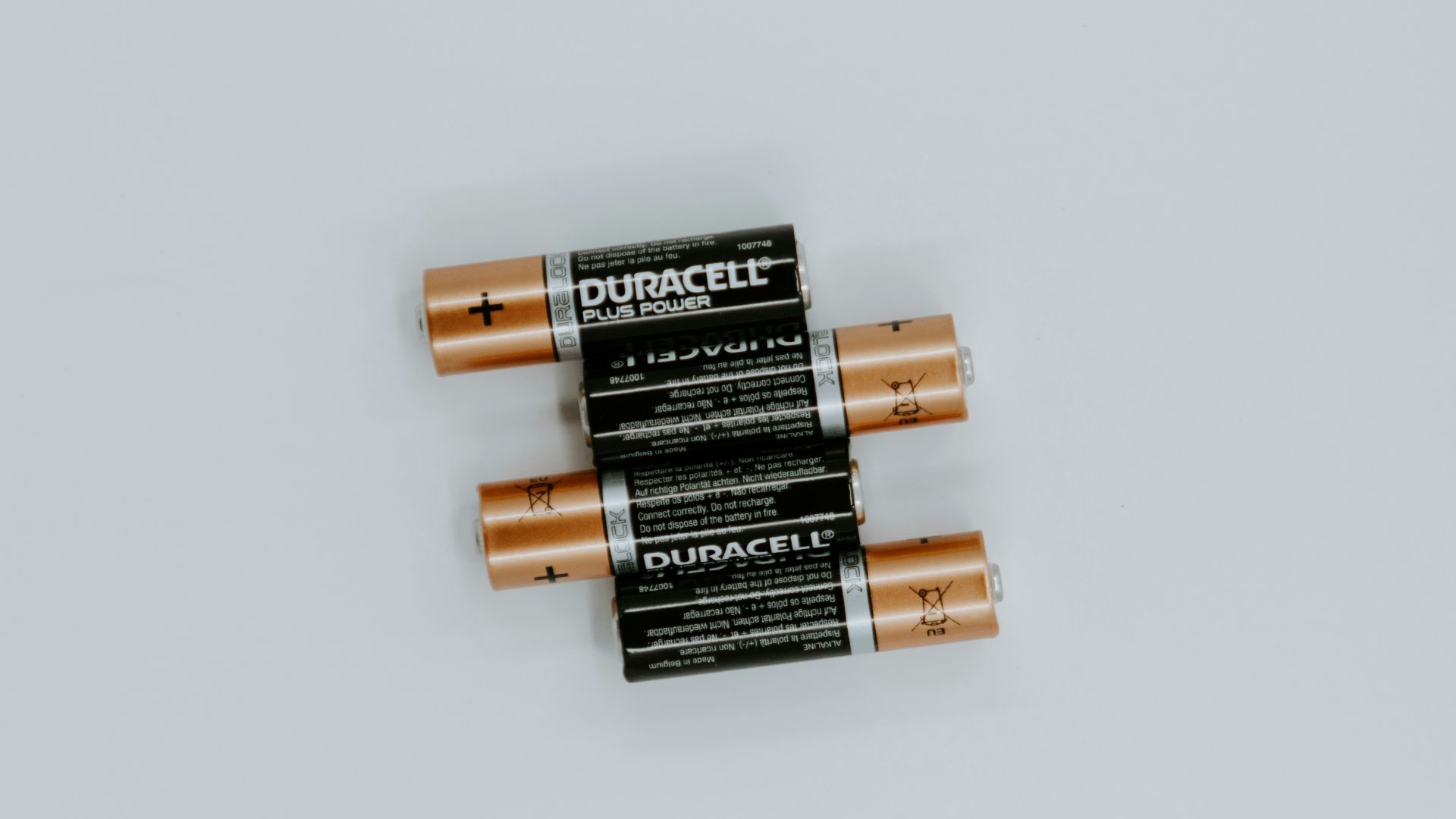 four black Duracell batteries