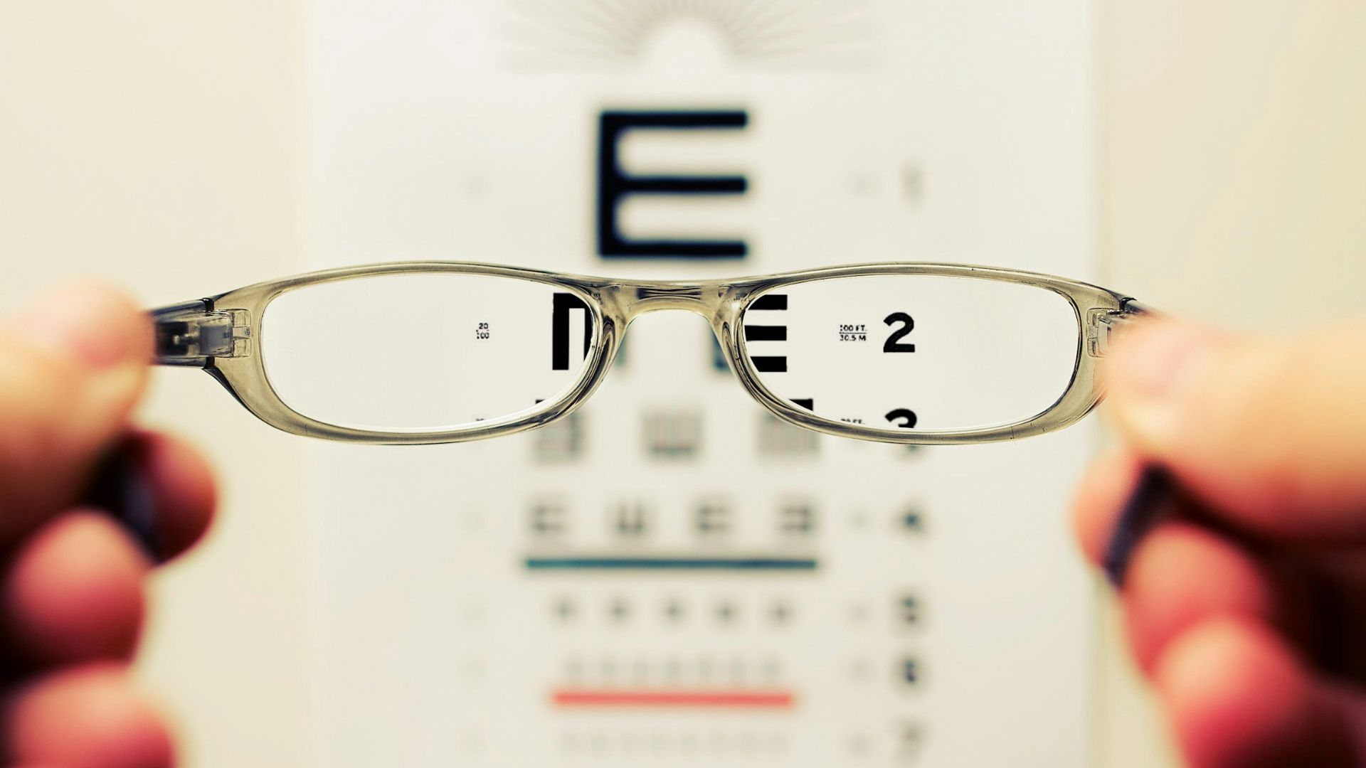 person holding eyeglasses