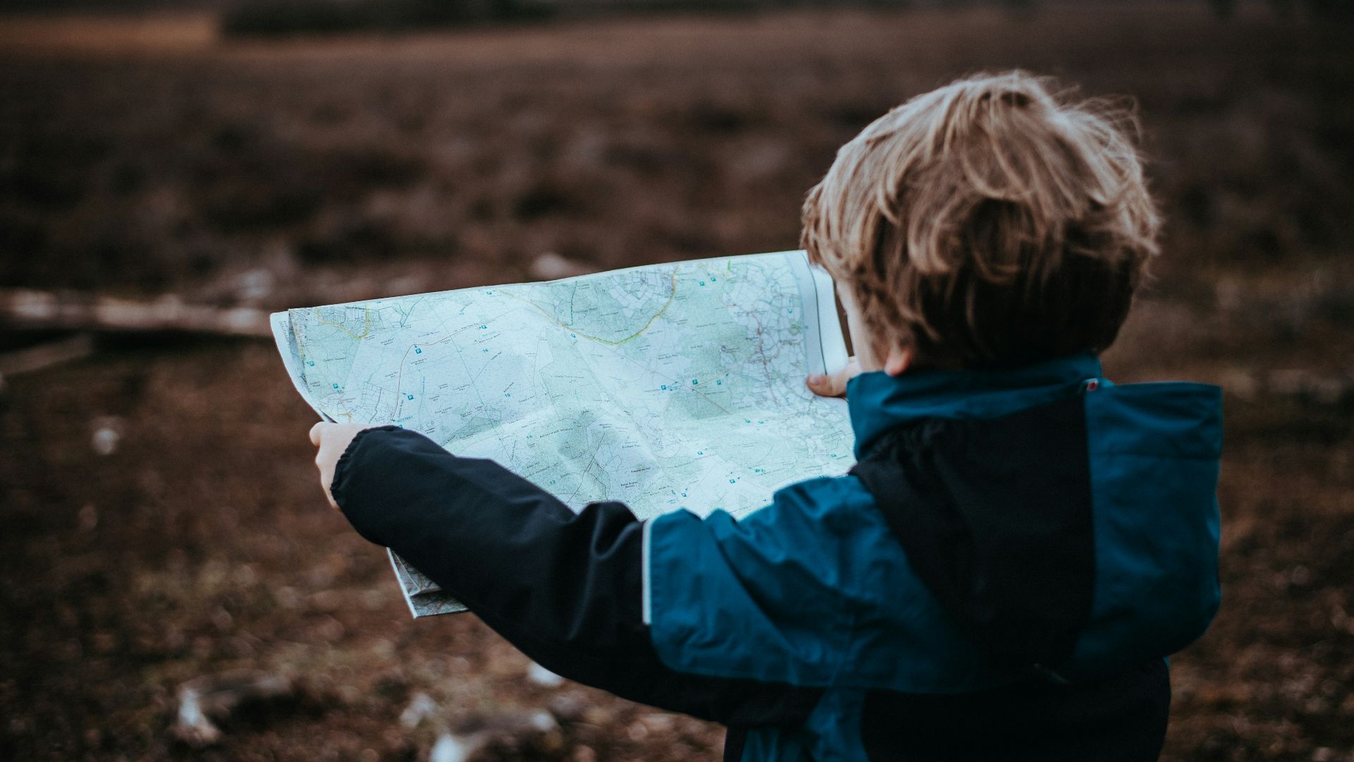 child looking at map