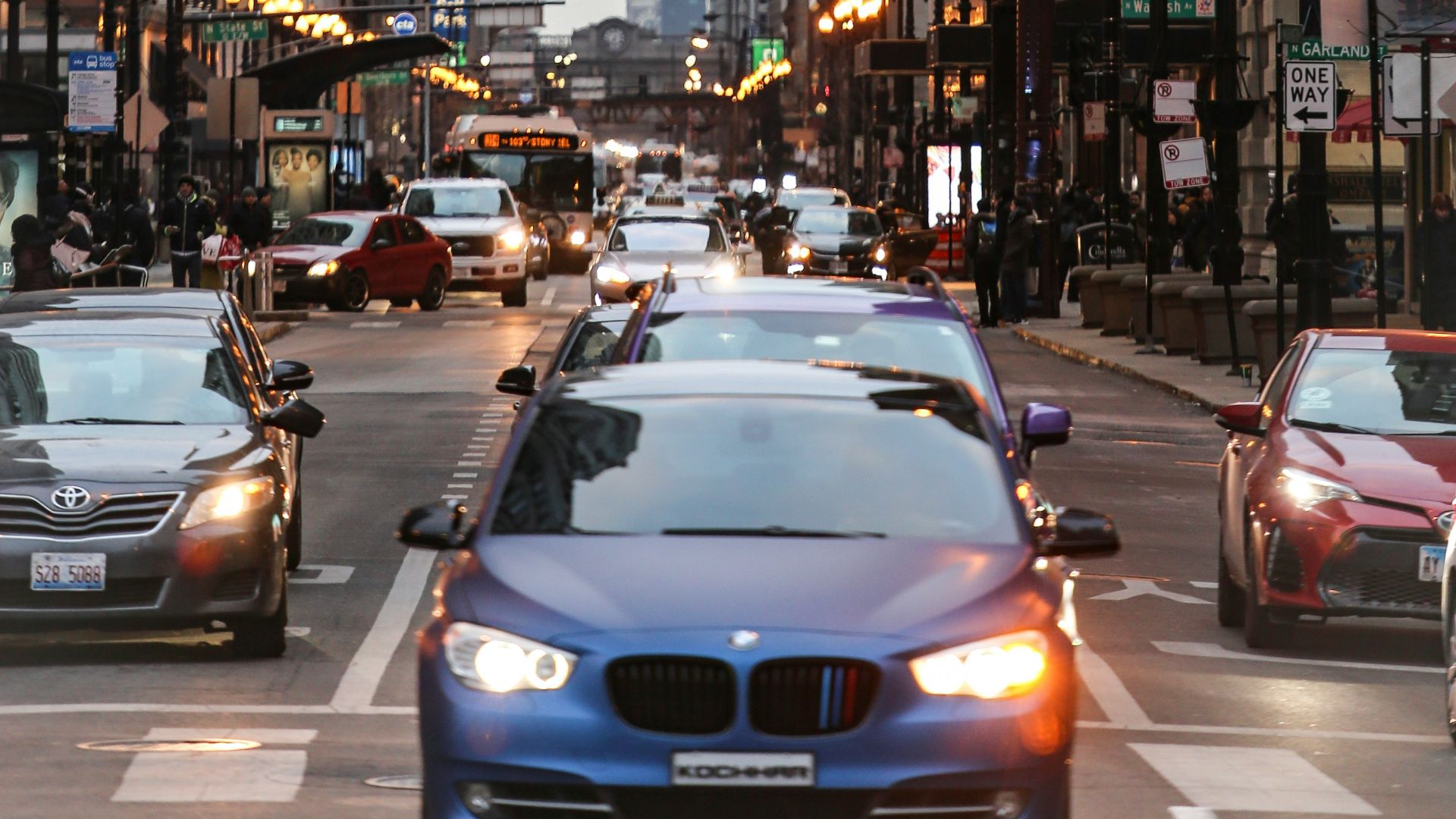 cars on road near buildings during daytime