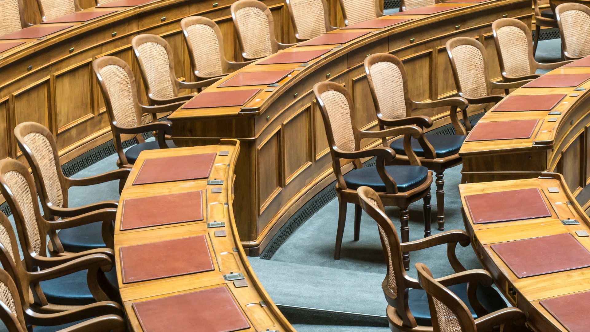 brown wooden chairs on blue and brown wooden floor