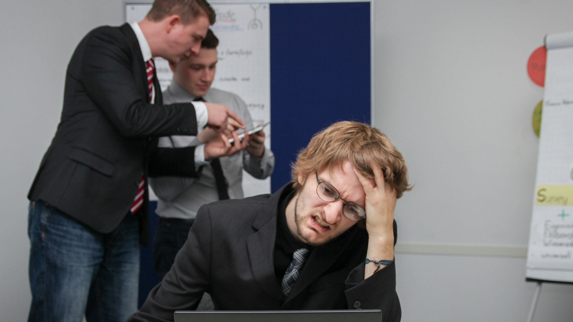 A man sitting in front of a laptop computer