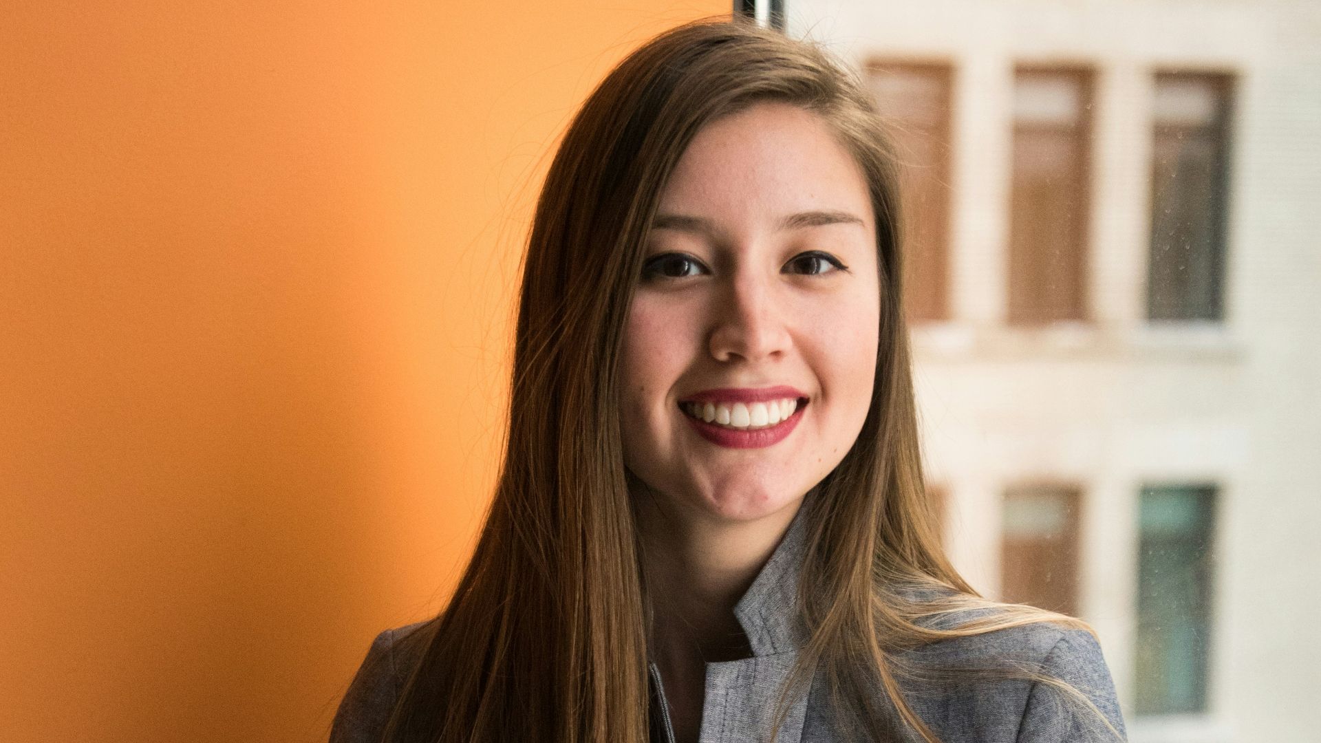 shallow focus photo of woman in gray jacket