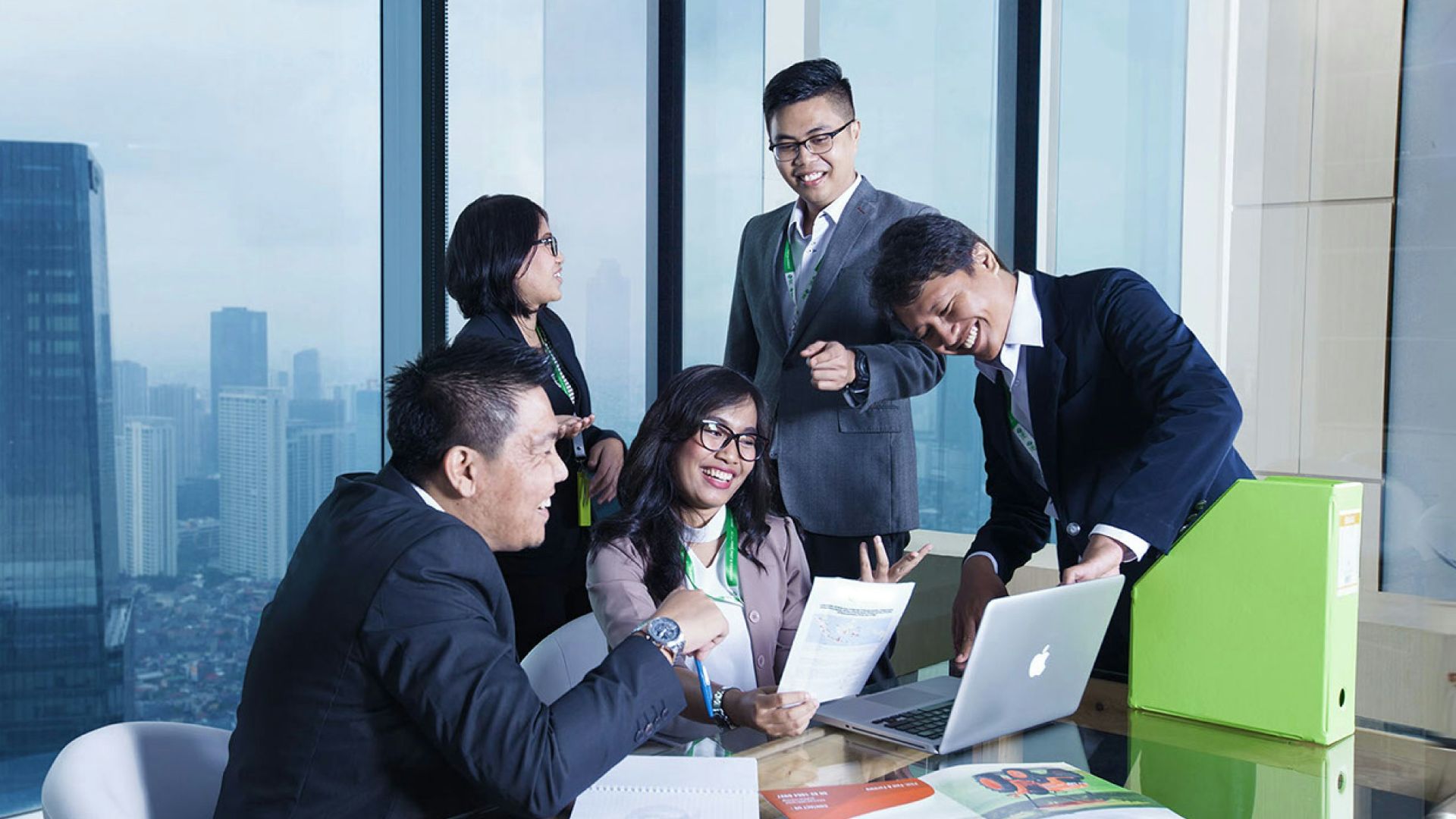 A group of business people sitting around a table