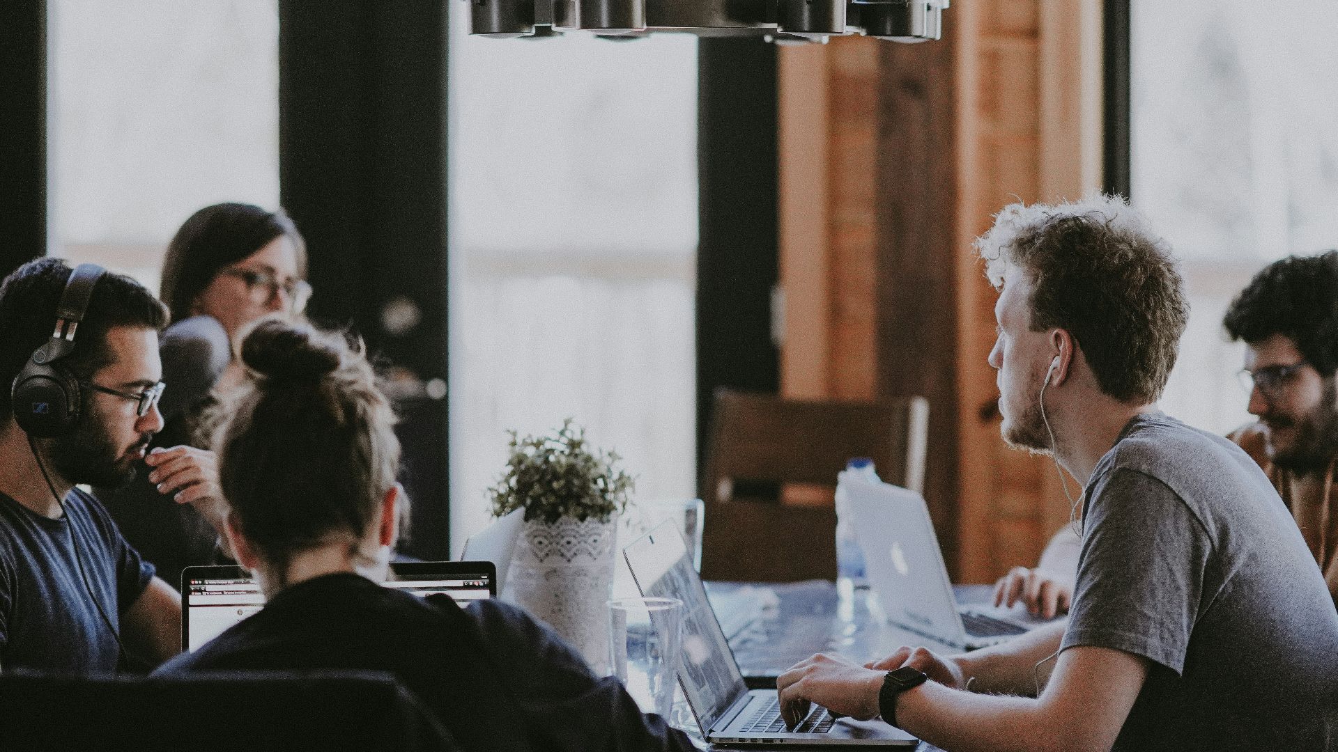 sittin people beside table inside room