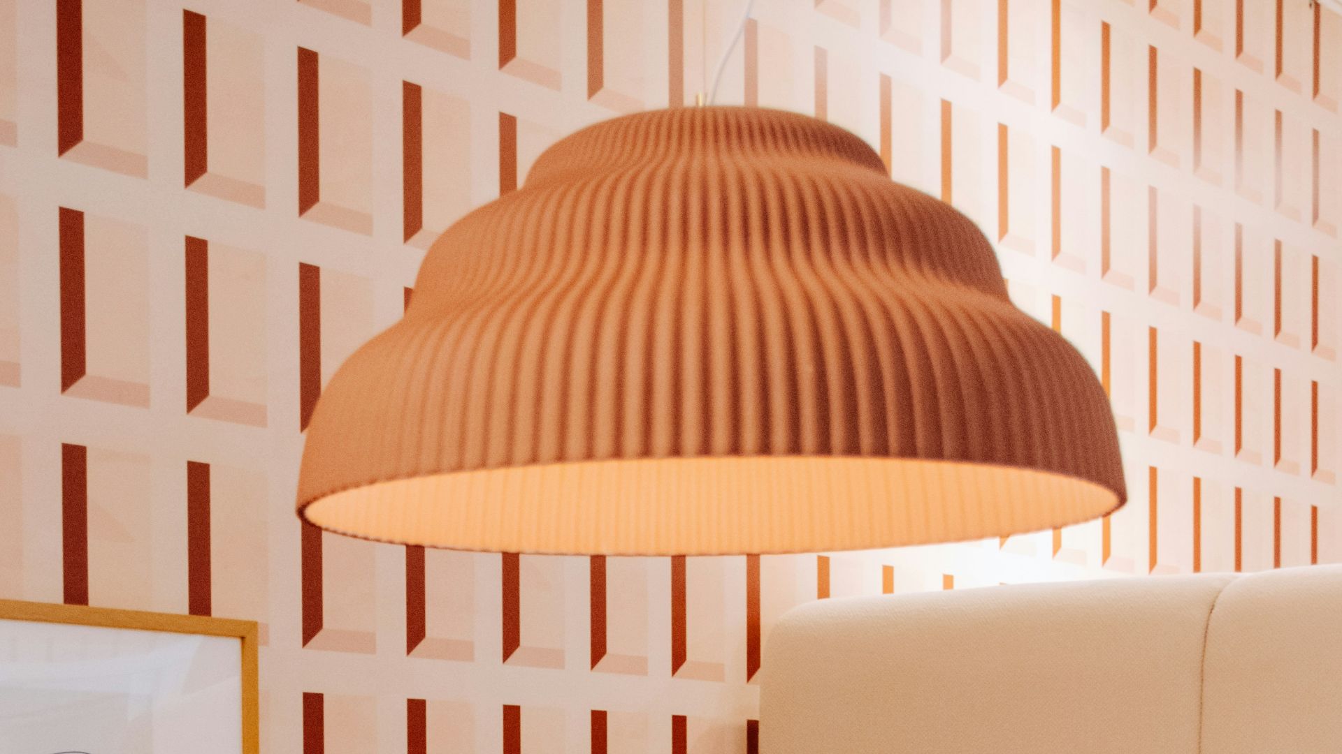 a living room with a couch and a lamp