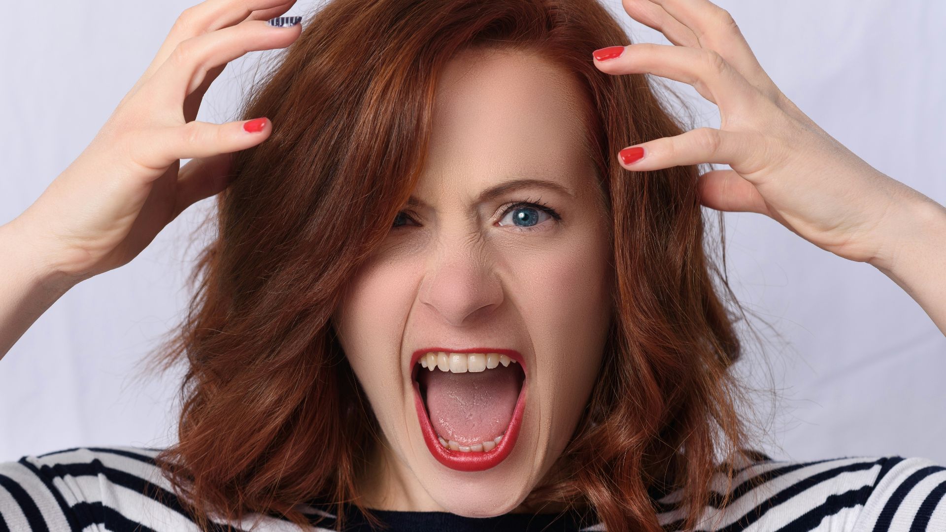smiling girl in black and white striped shirt
