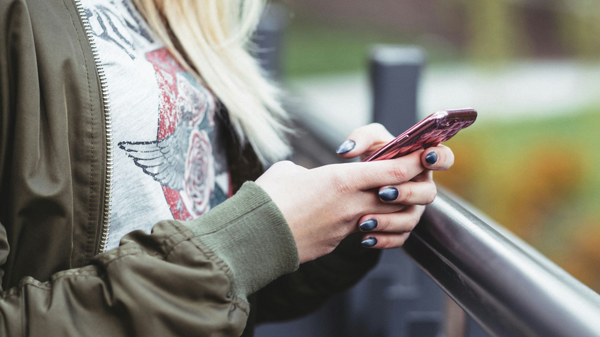 woman holding red phone