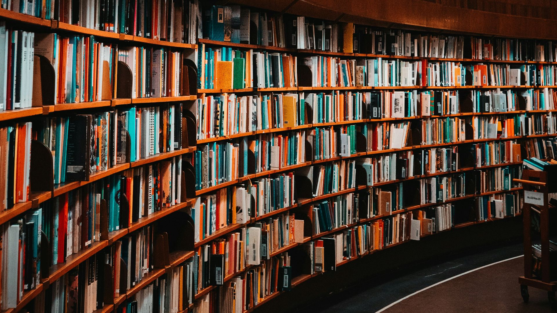 photo of brown wooden bookshelf