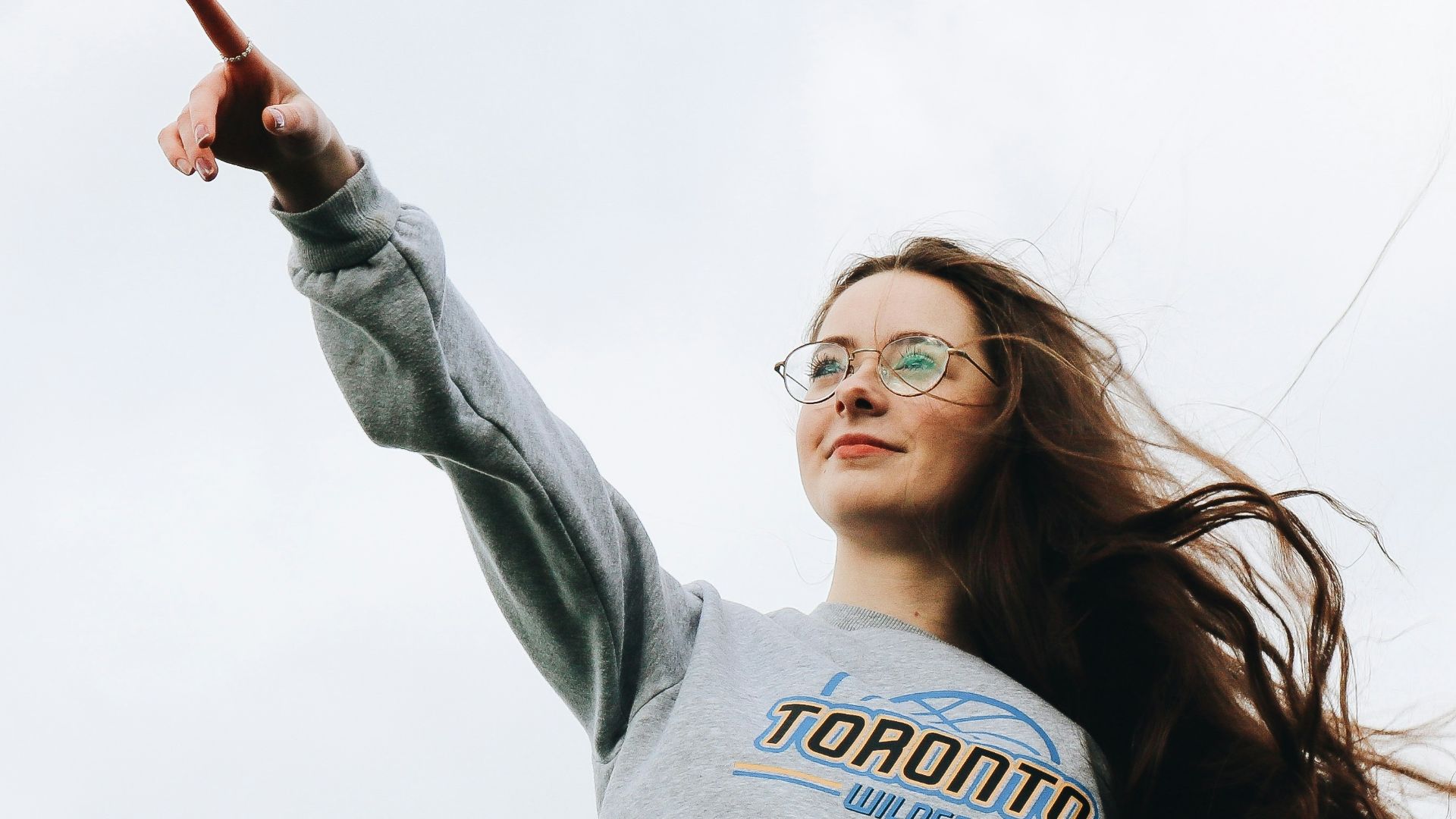 woman pointing using her right hand