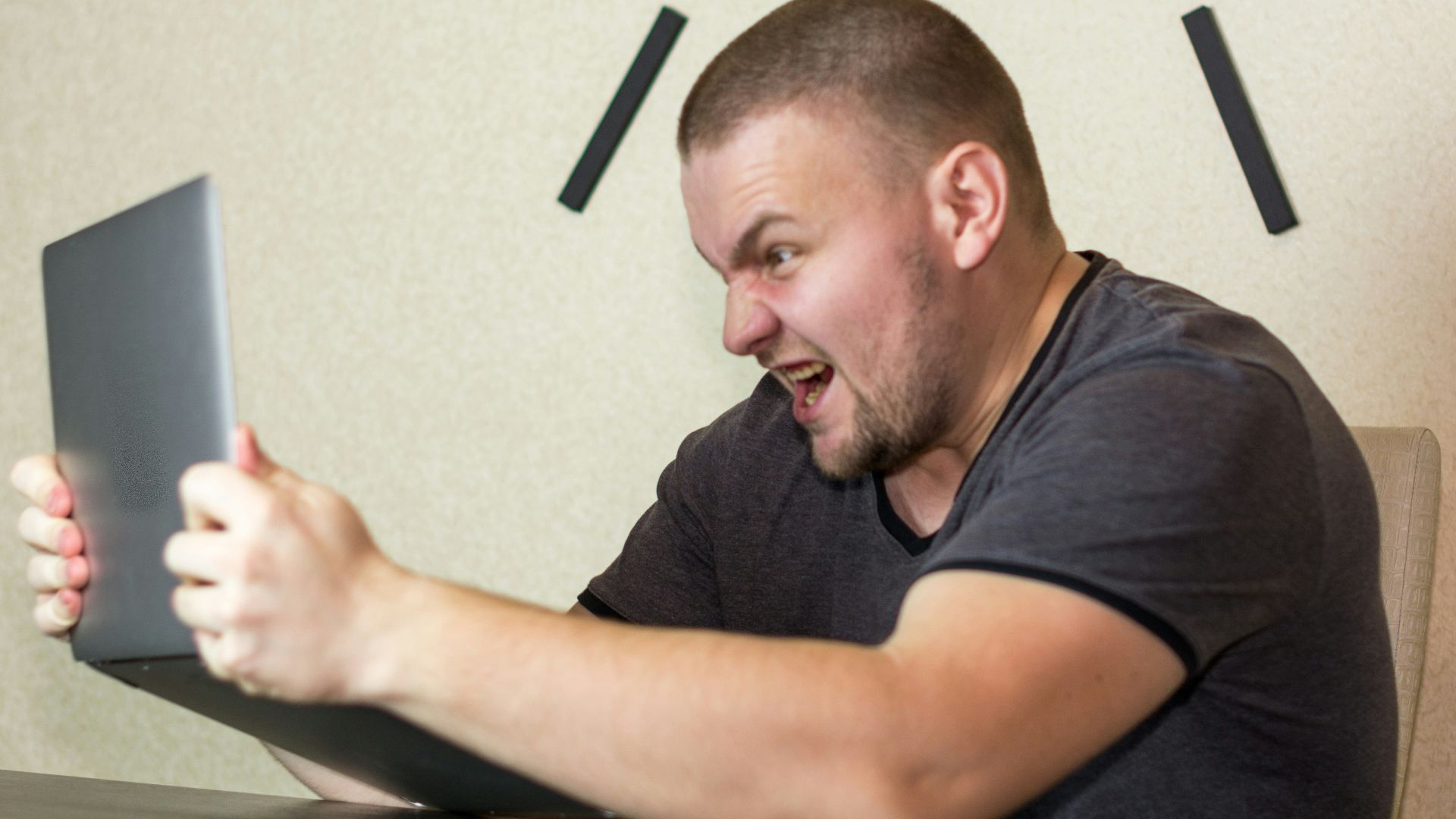 a man sitting in front of a laptop computer
