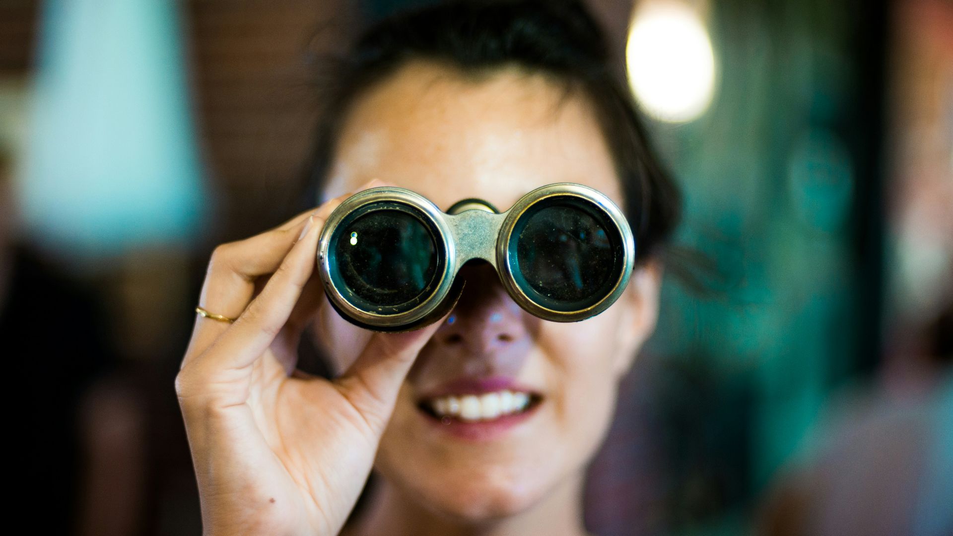 woman using gray binoculars