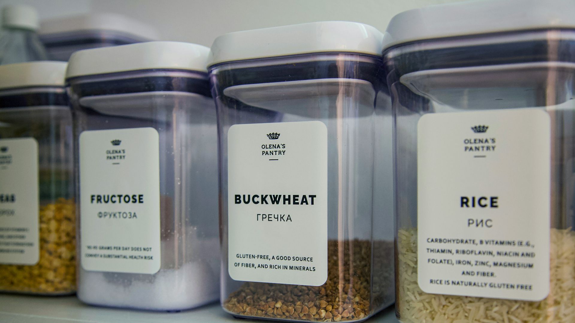 2 clear glass jars on white shelf