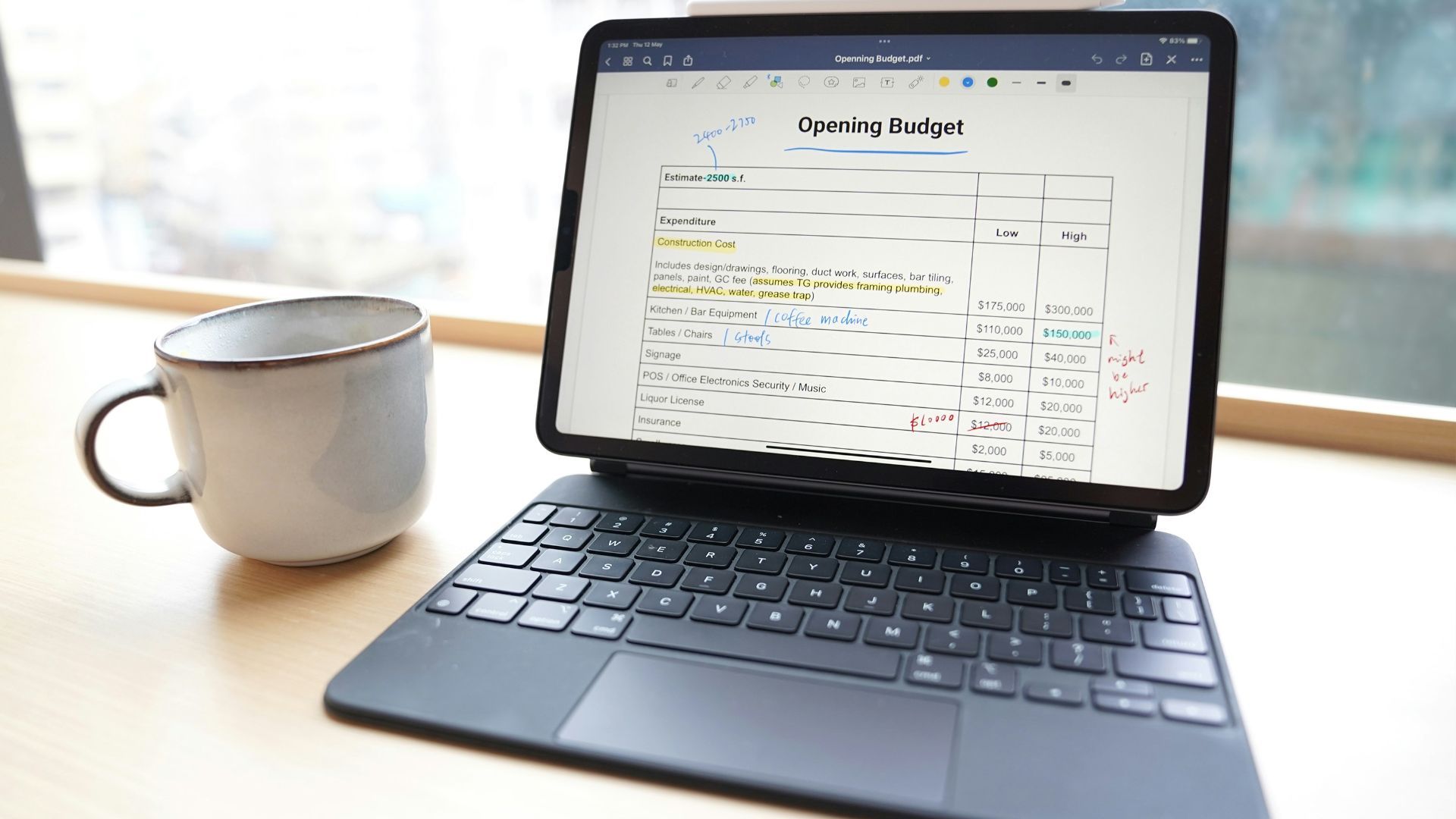 a laptop and a cup of coffee