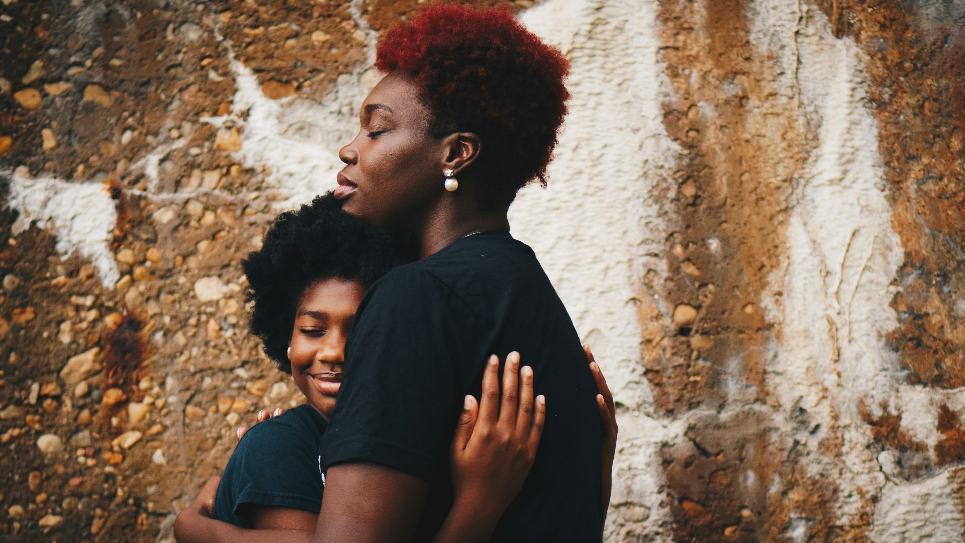 two women hugging each other