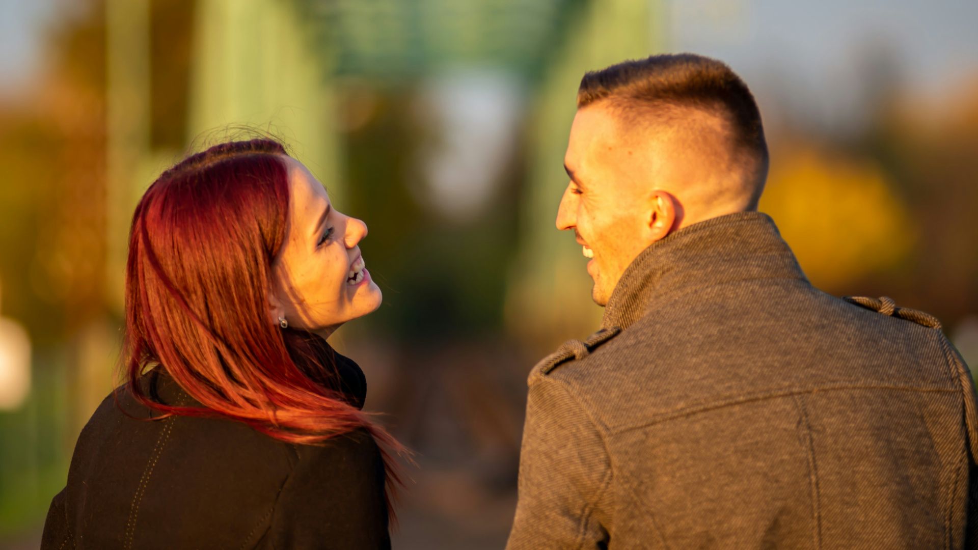 man and woman standing side by side during daytime