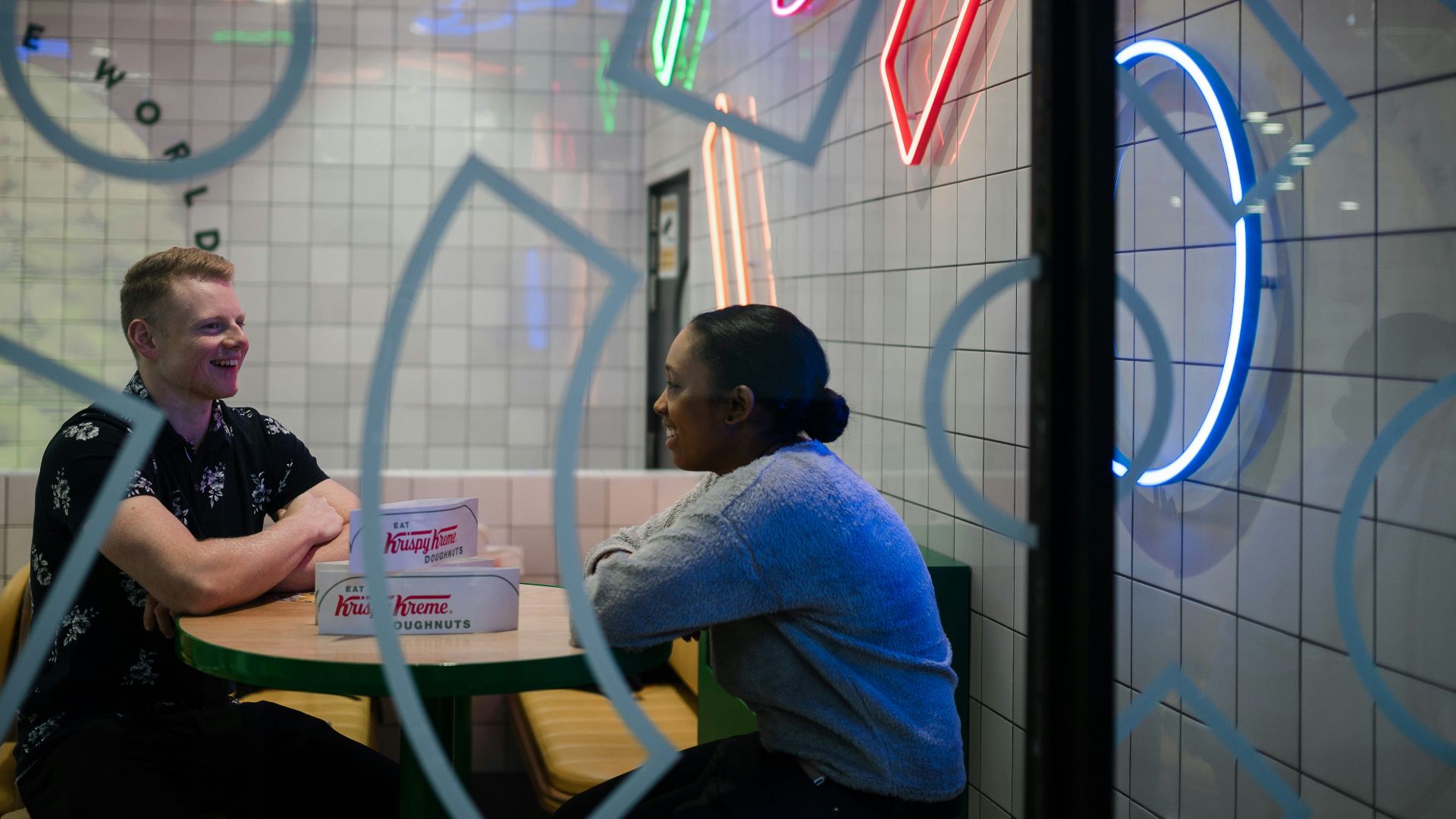 man and woman walking inside store