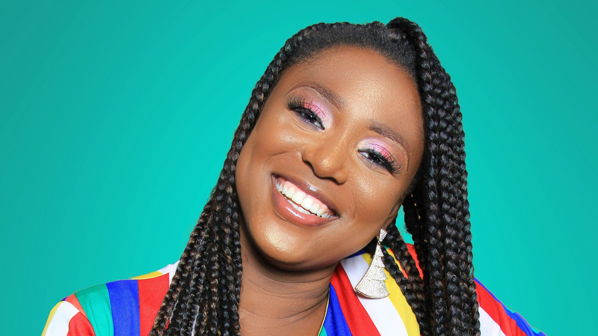 woman holding her hips while smiling