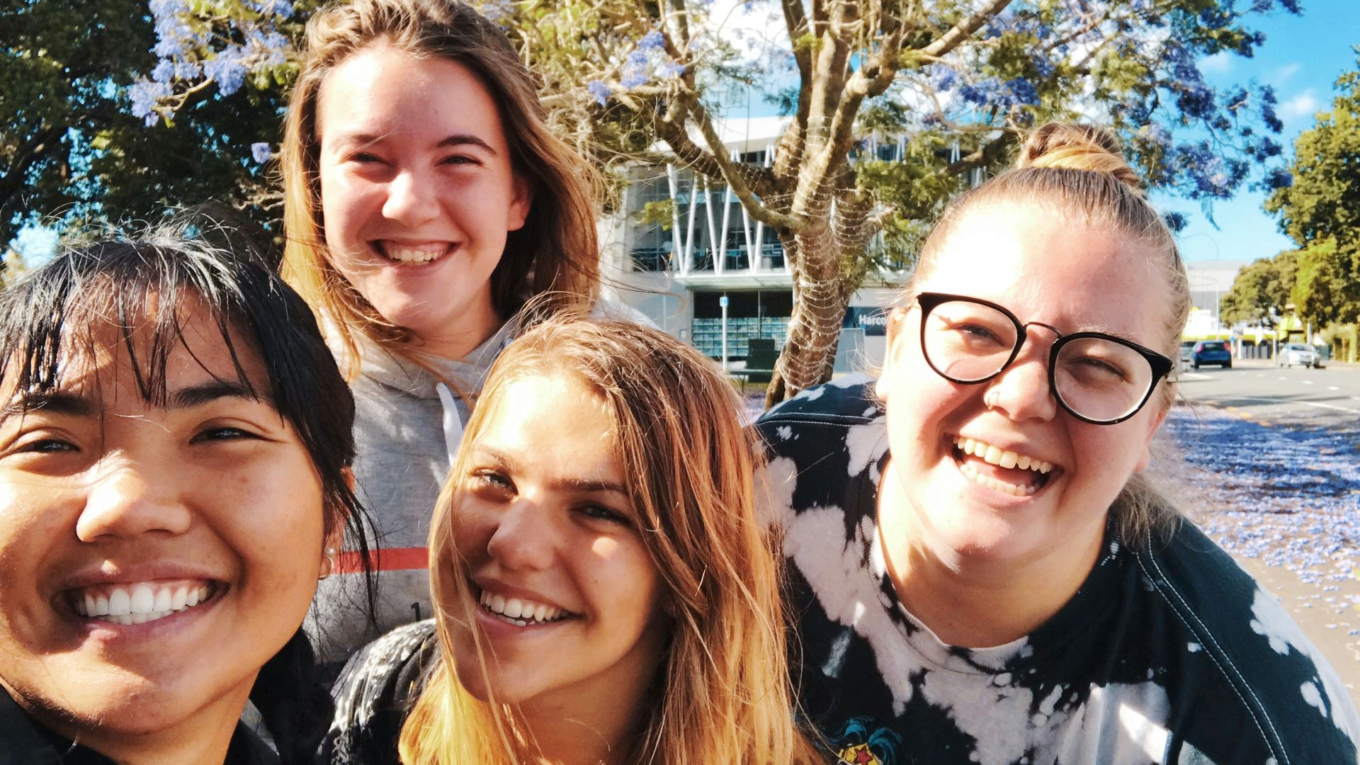 four girl smiling outdoor