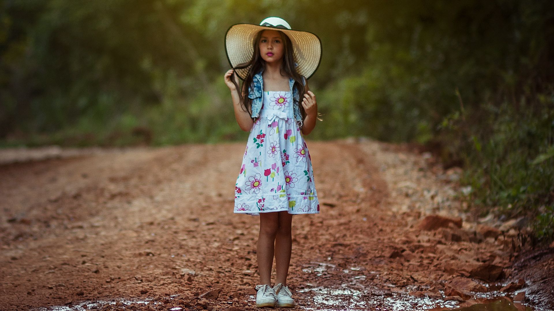 girl standing in front body of water