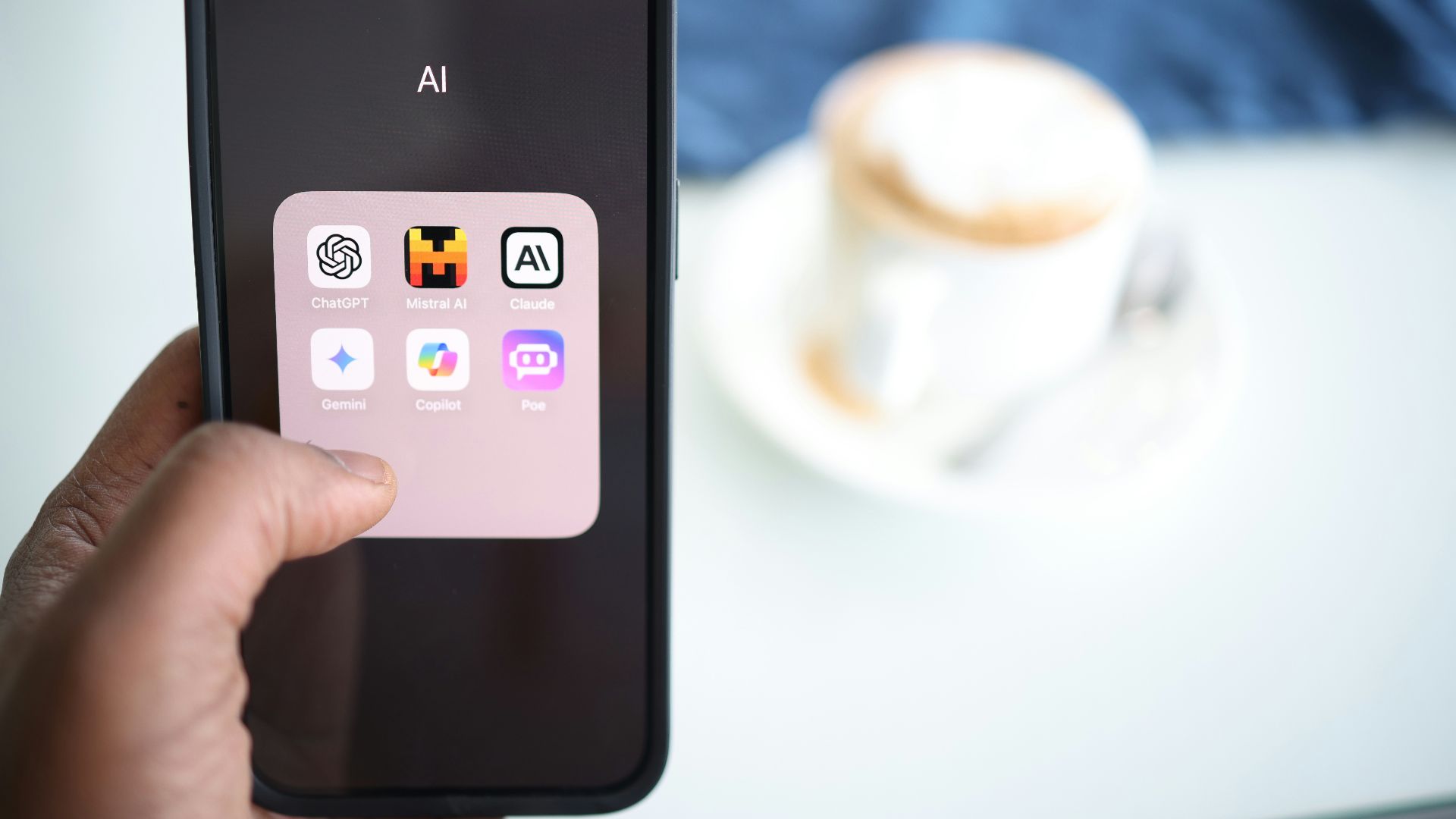 a person holding a cell phone in their hand