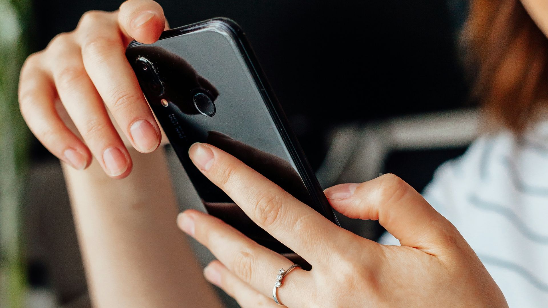a close up of a person holding a cell phone