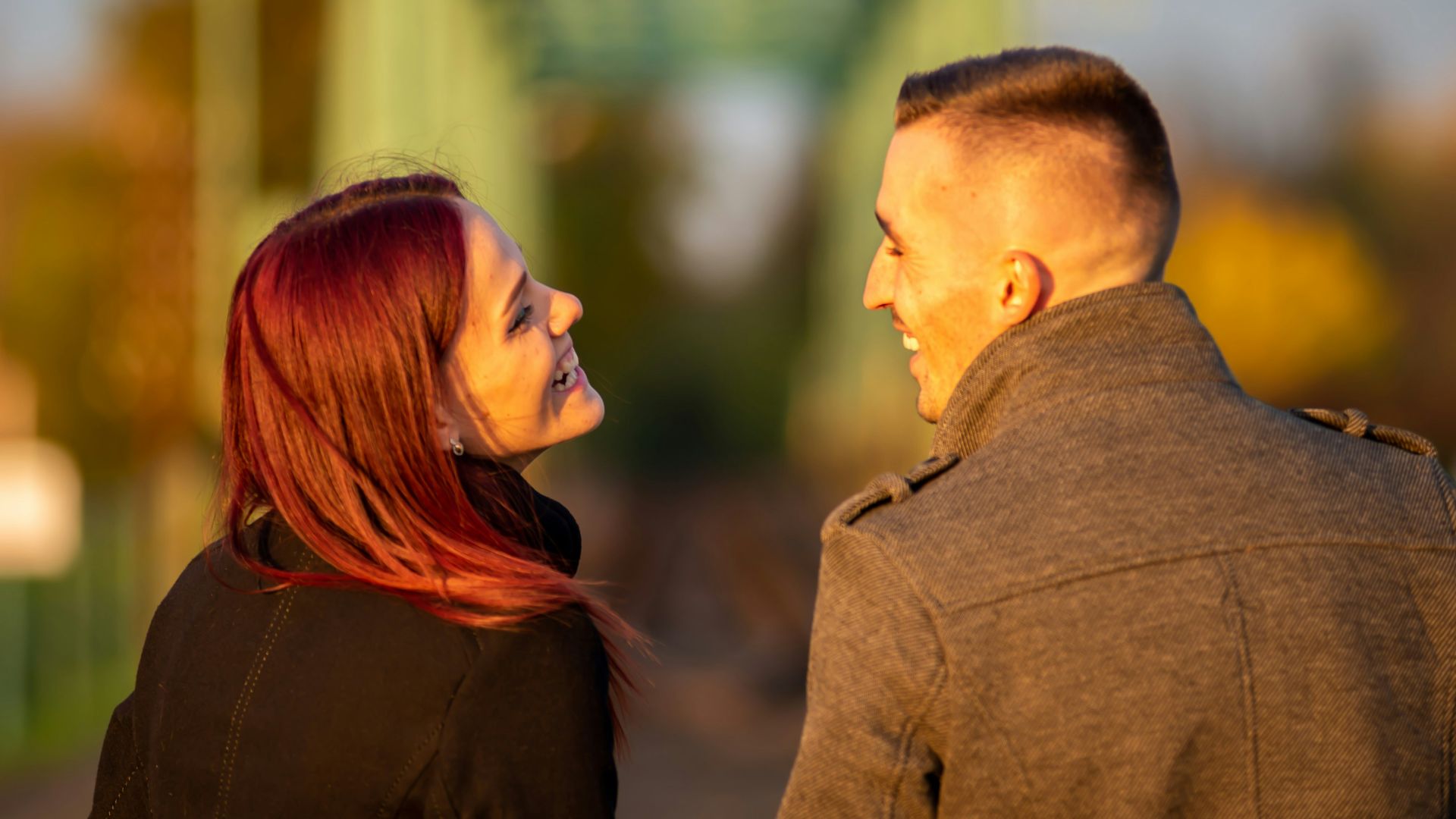 man and woman standing side by side during daytime