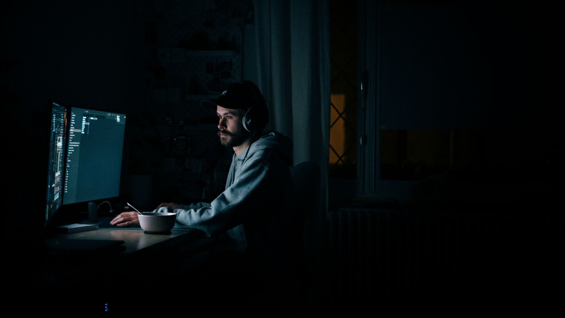 man in gray hoodie wearing black sunglasses