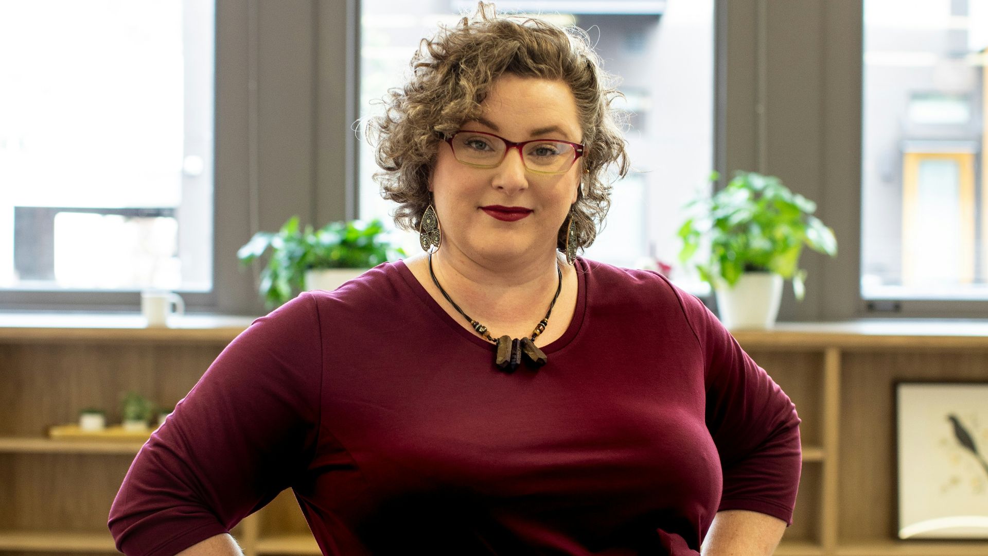 woman in red 3/4-sleeved dress