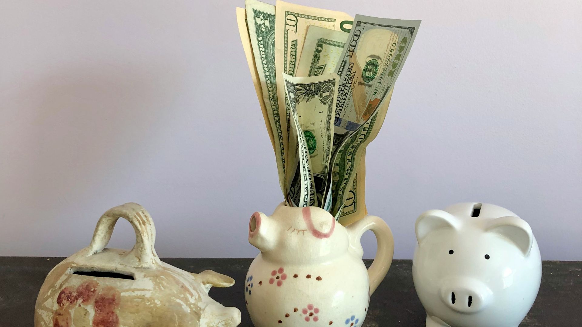 white ceramic teapot beside white ceramic teapot