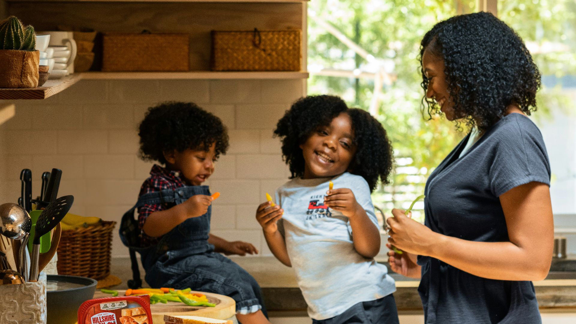 woman in white t-shirt standing beside woman in black and white stripe shirt