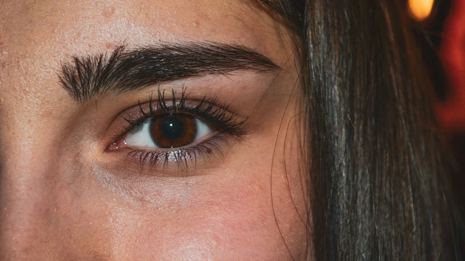 woman with black hair and blue eyes
